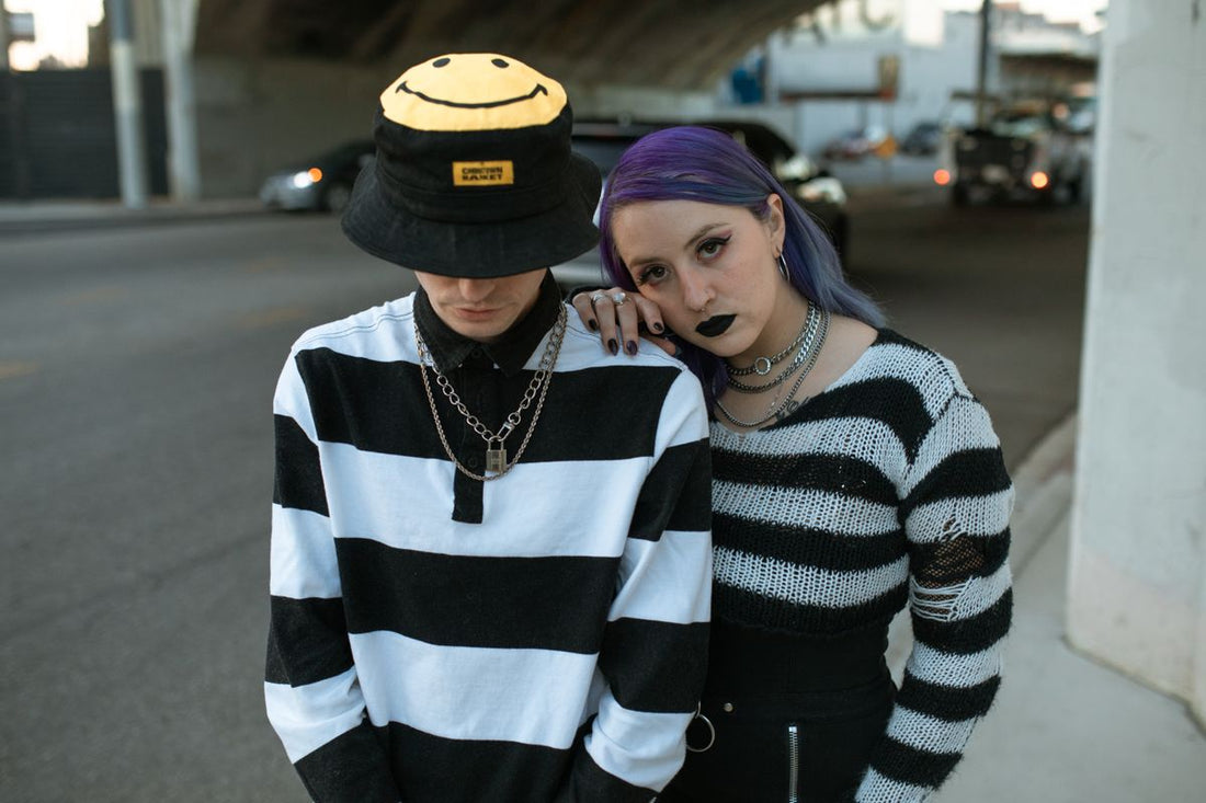 Lifestyle photo of two stylish models wearing jewelry in an urban setting