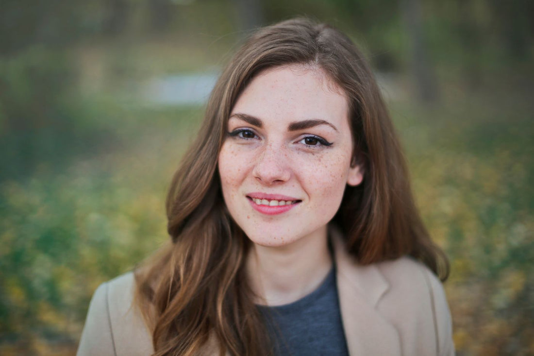 Model in a white shirt and denim with silver jewelry styling